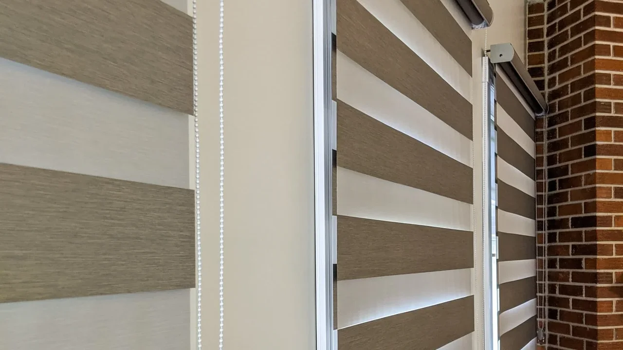 Close up on a plate of mashed potatoes, topped with baked pork chops with cream of mushroom soup, and a side of green beans.