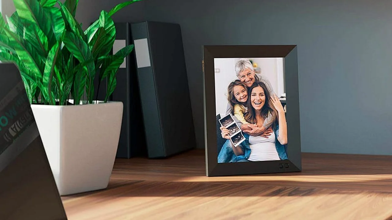 Close up on a plate of mashed potatoes, topped with baked pork chops with cream of mushroom soup, and a side of green beans.