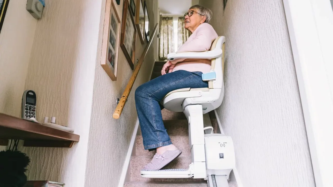 Close up on a plate of mashed potatoes, topped with baked pork chops with cream of mushroom soup, and a side of green beans.