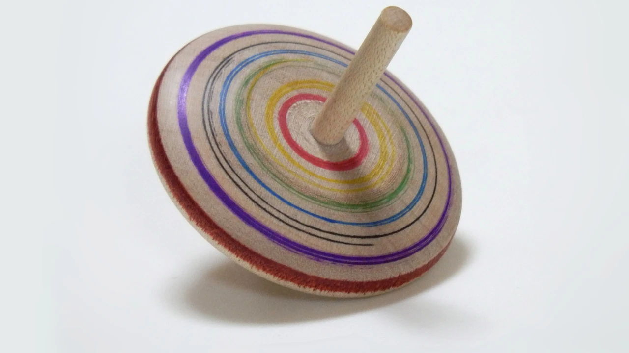 overhead view of corned beef sliced and on a platter with cabbage, potatoes, and carrots