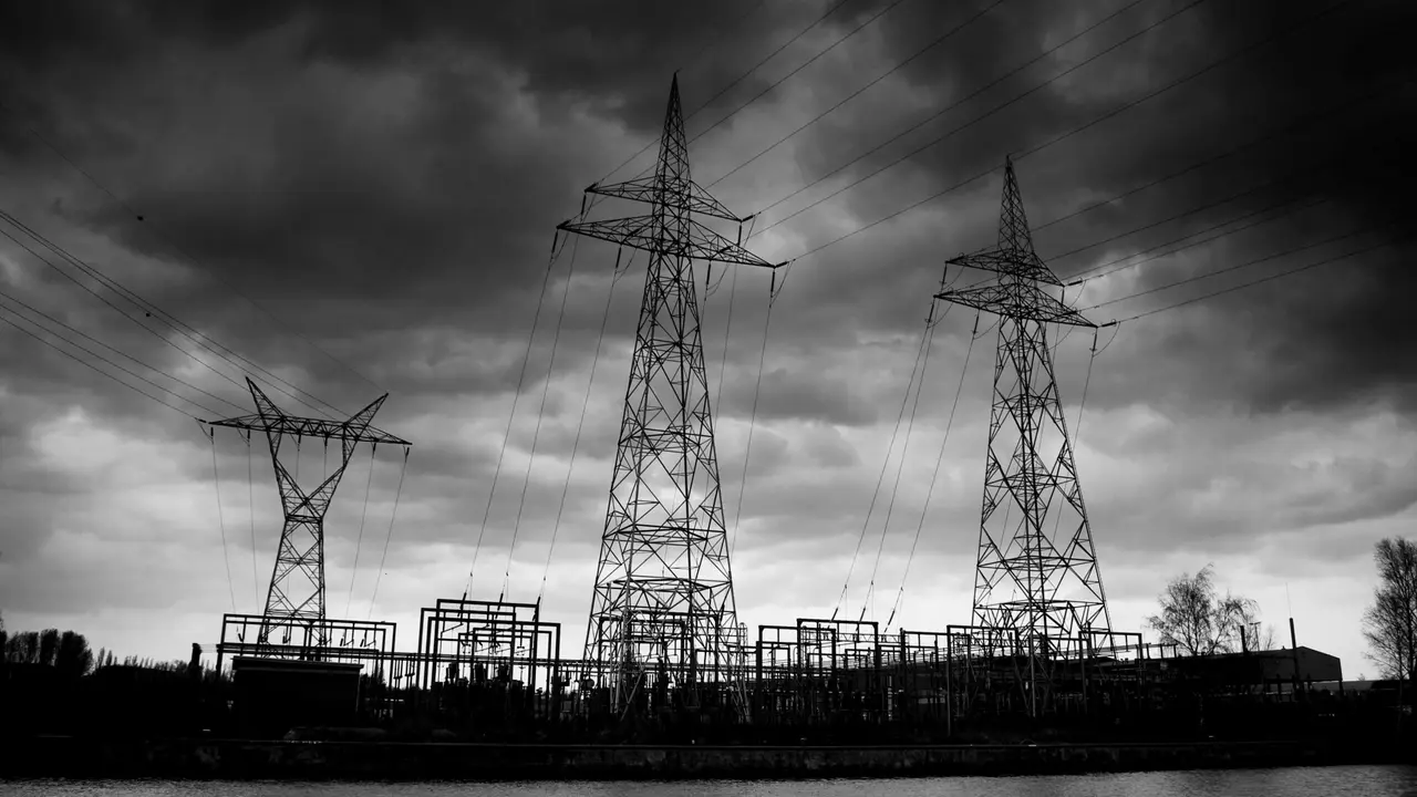 Close up on a plate of mashed potatoes, topped with baked pork chops with cream of mushroom soup, and a side of green beans.